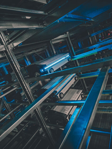 Warehouse shuttle system, dark with blue light