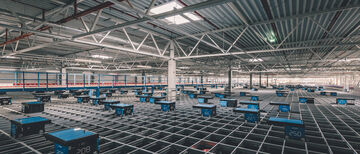 Autostore system with multiple robots in an arvato warehouse