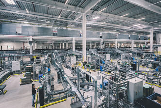 a large warehouse with a complete conveyor line in general view