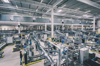 a large warehouse with a complete conveyor line in general view