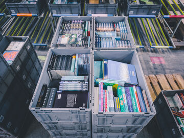 Books in transport boxes in preparation for shipment