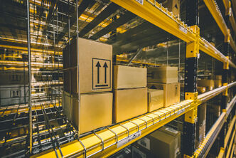 packages stored in a yellow high rack