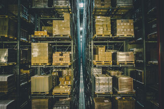 A narrow aisle high bay logistics warehouse with stored pallets